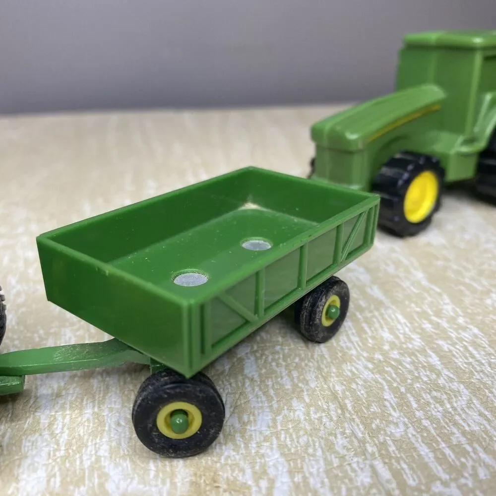 ERTL John Deere Tractor & Trailer and Stationary Plastic Tractor with 2 Rakes
